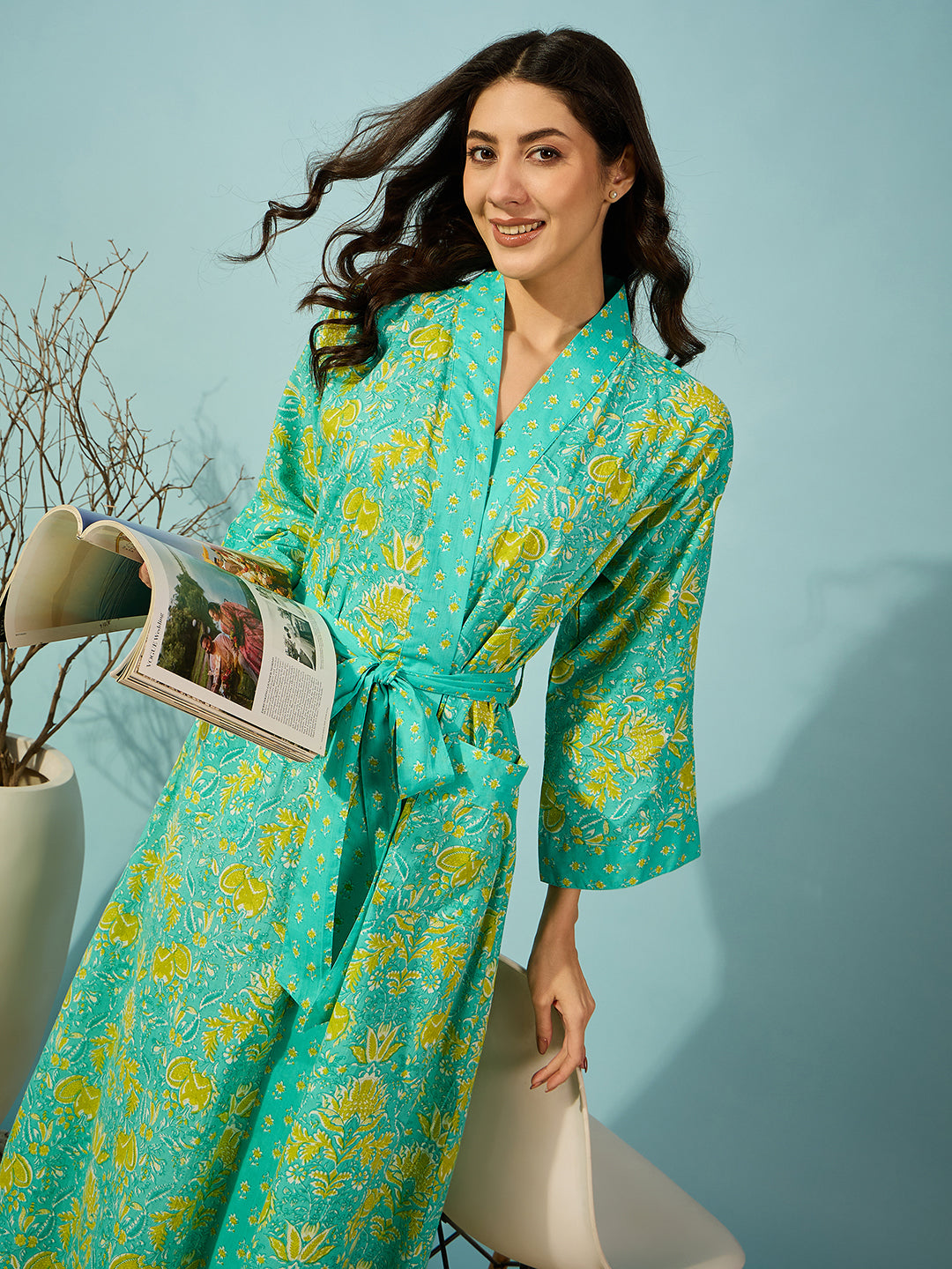 Soft blue cotton gown with a floral pattern and flattering wrap design.
