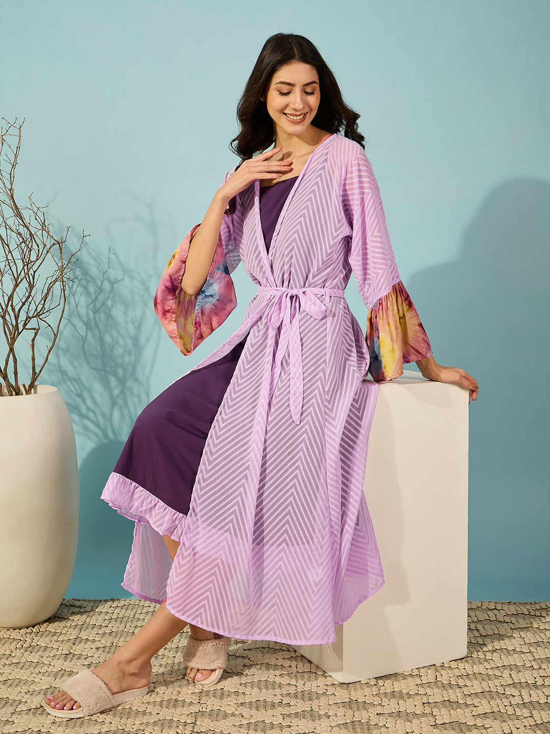 Lavender gown set with unique tie-dye sleeve patches, offering an elegant design with ruffled slip.
