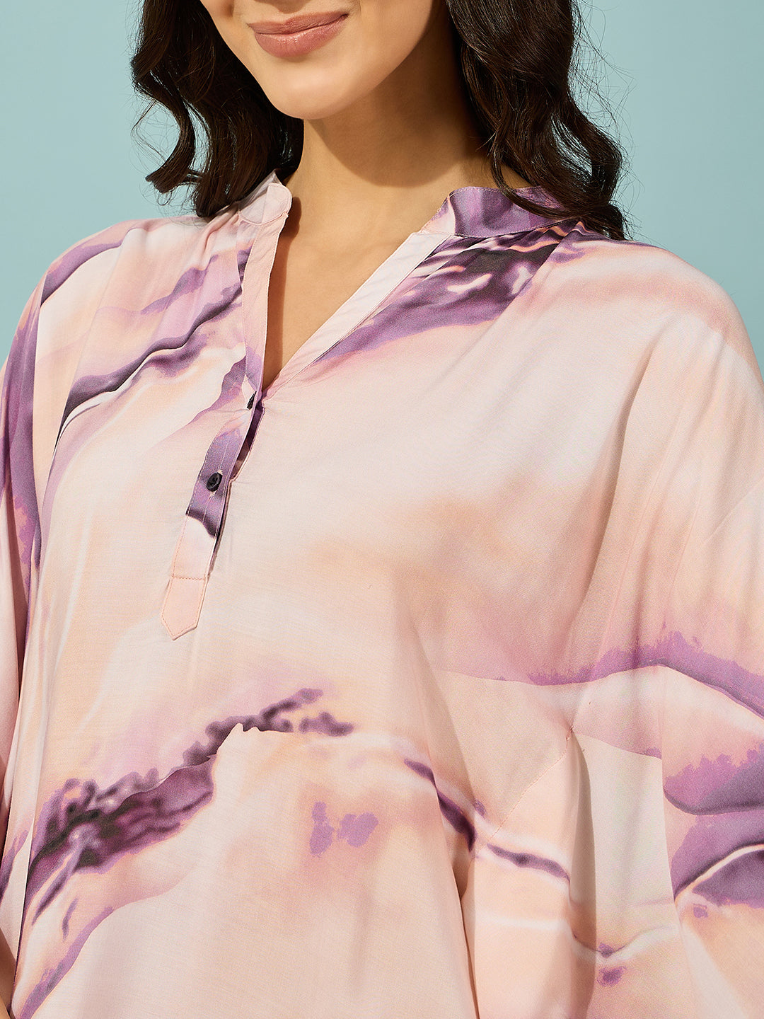 Comfortable and elegant purple marble print kaftan, featuring button placket and loose fit.
