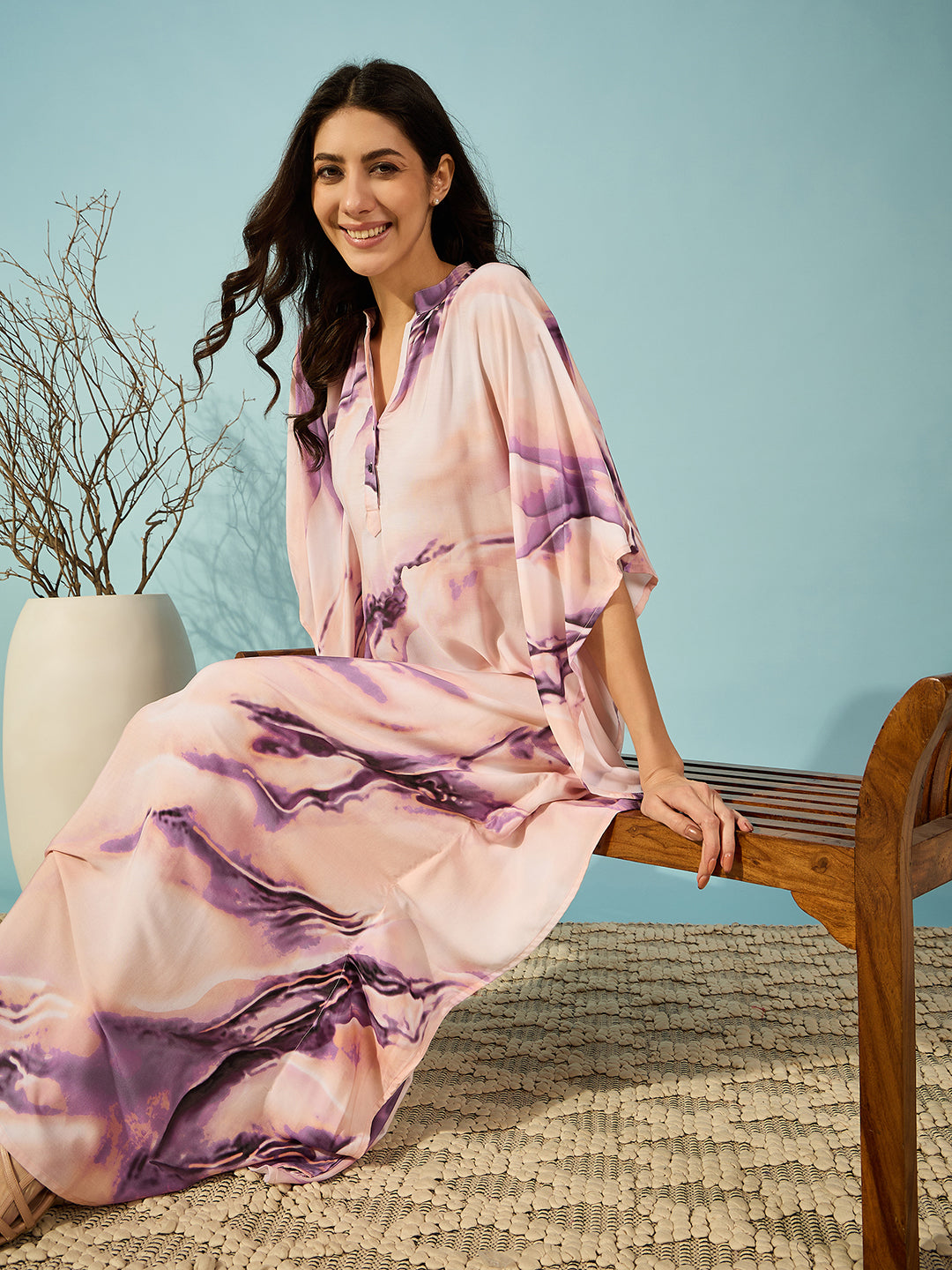 Graceful purple marble print kaftan with a mandarin collar, perfect for any event.
