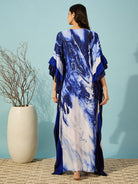 Comfortable and elegant, this blue marble print kaftan with ruffle detailing is a must-have for your wardrobe.
