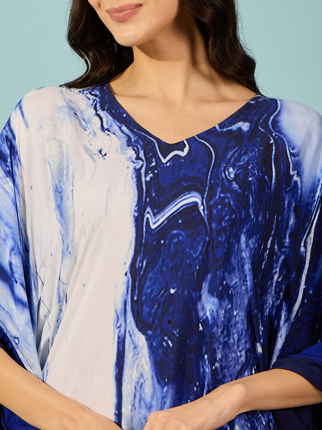 Blue marble print kaftan with trendy ruffles on the sides for a perfect fit and feel.
