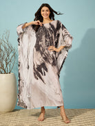 Black marble print kaftan for women, featuring double ruffle detail, perfect for casual outings and loungewear.
