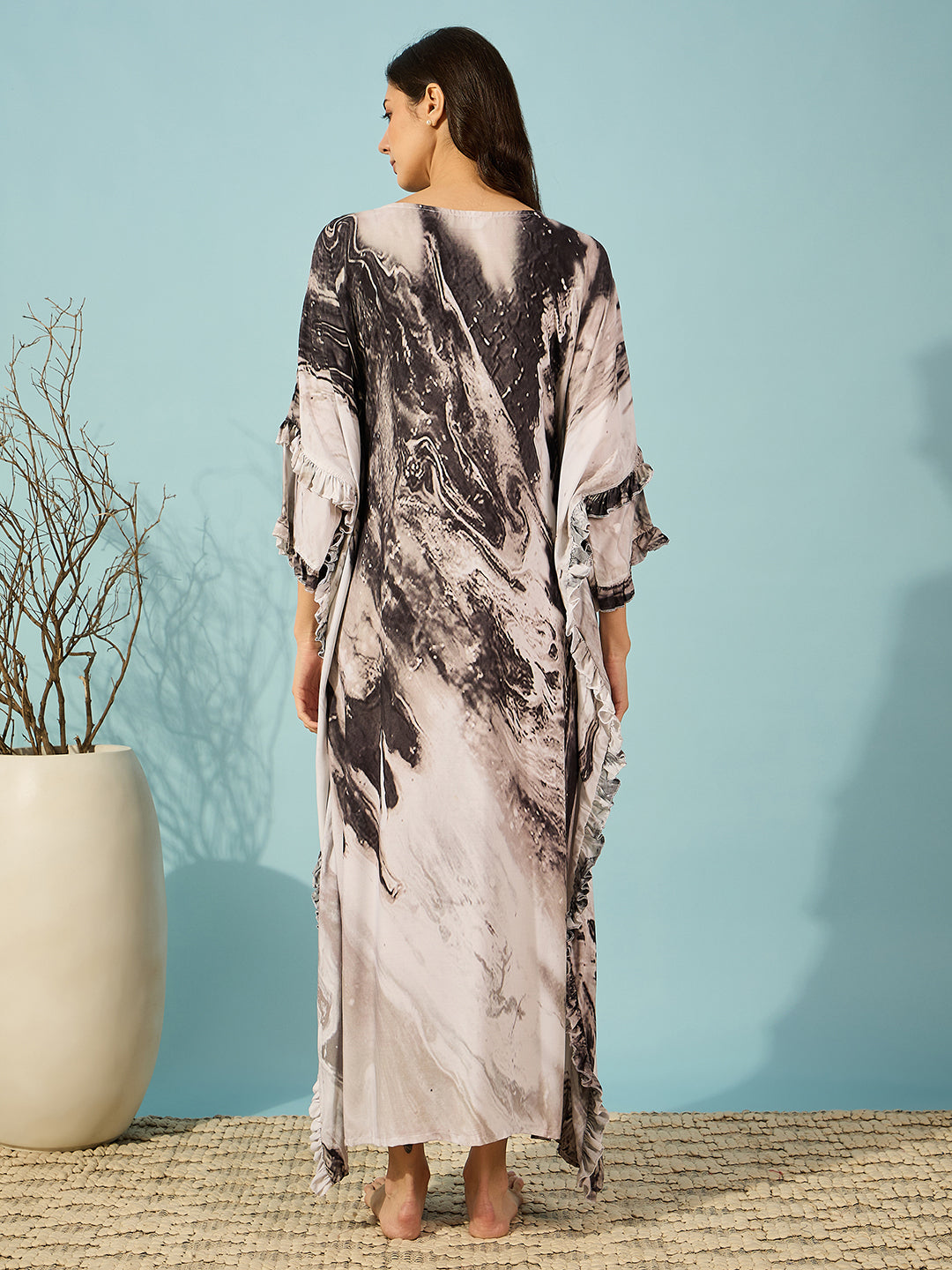 Comfortable and chic black marble print kaftan dress for women, ideal for any occasion, with double ruffle detail.
