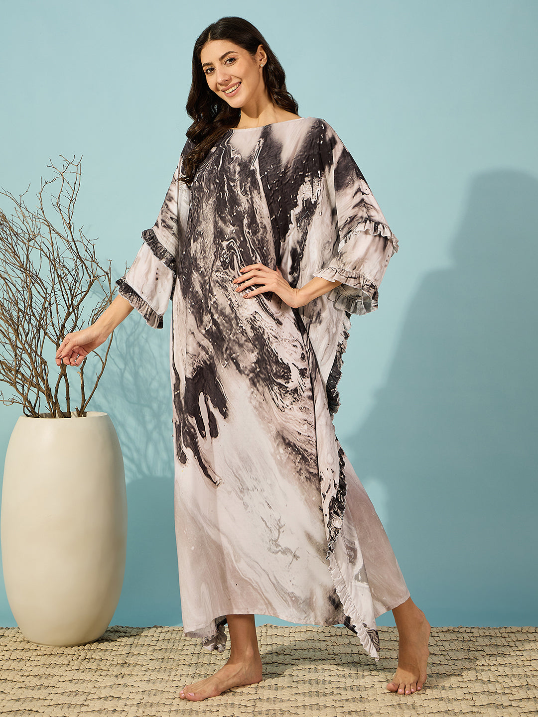 Women's soft black marble kaftan with a slim fit and stylish ruffle detailing, available in multiple sizes.
