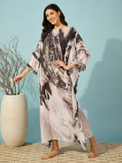 Women's soft black marble kaftan with a slim fit and stylish ruffle detailing, available in multiple sizes.
