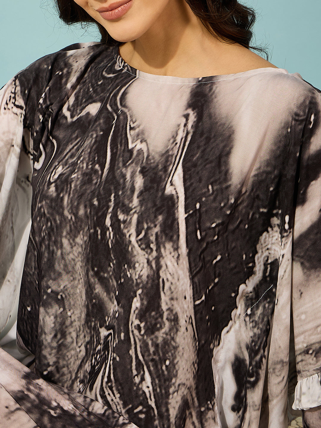 Stylish black marble kaftan dress with double ruffle accents, a must-have for casual elegance and comfort.
