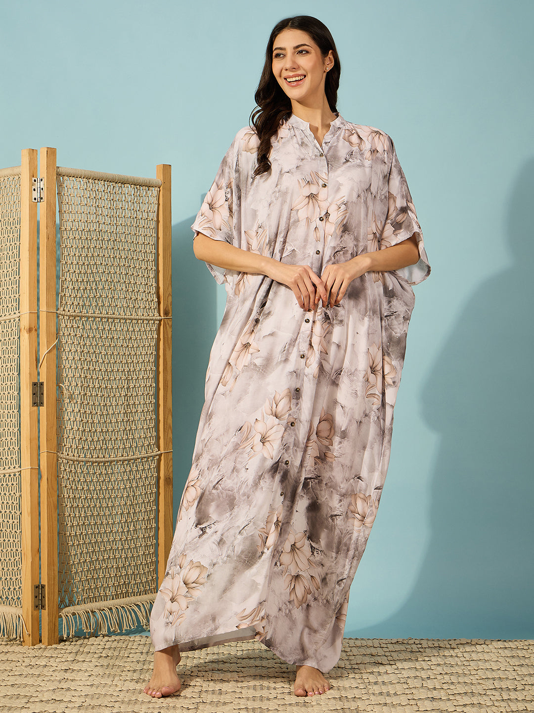 Elegant marble floral print kaftan dress with soft pleats for a luxurious and comfortable look.
