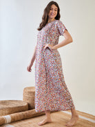 Comfortable and stylish cotton nightdress with red floral patterns.