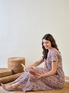 Cotton red floral nightdress, ideal for comfortable lounging at home.