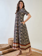 Soft, comfortable pin tuck nightdress in black with floral accents.
