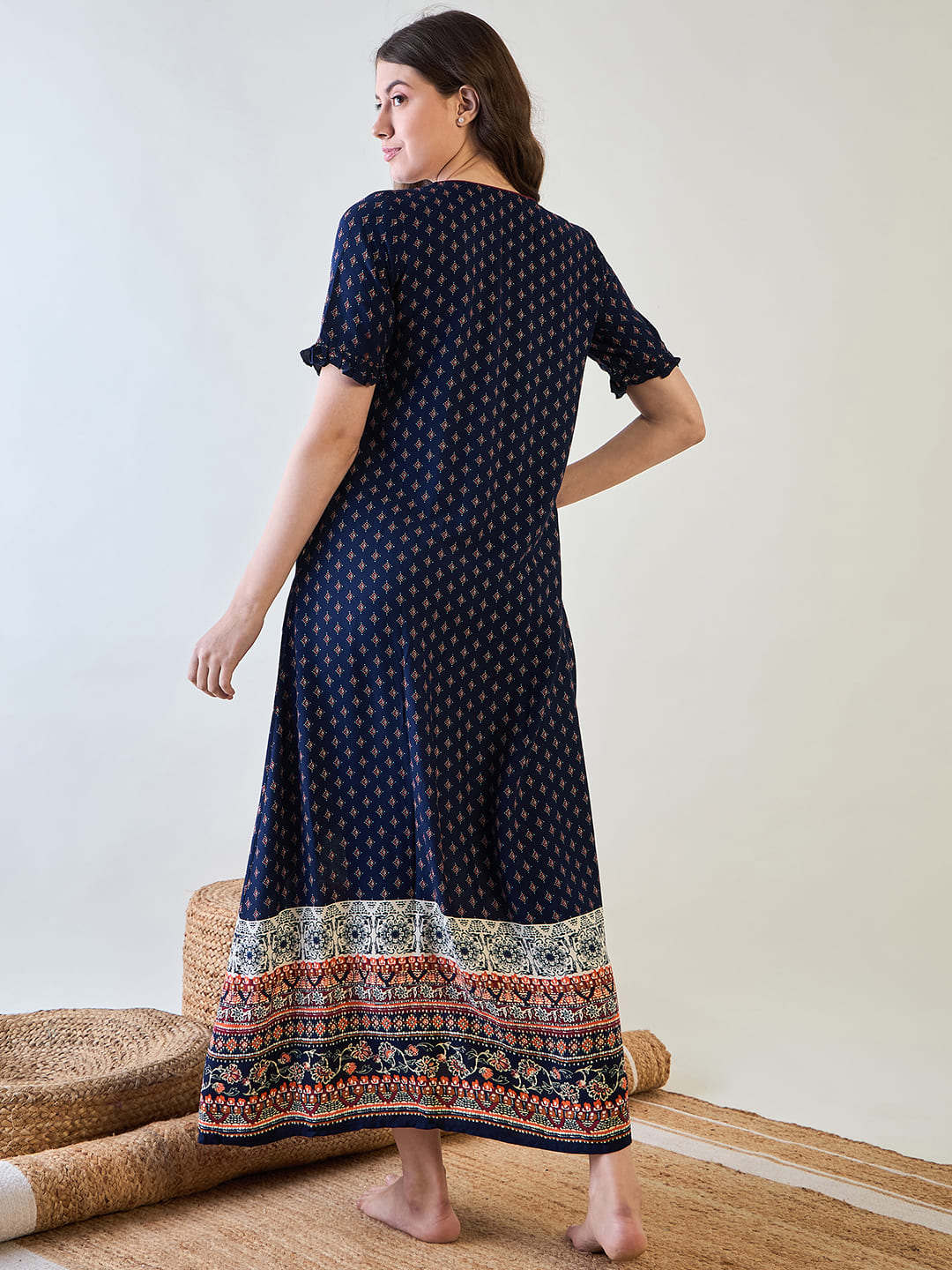 Navy blue night dress with a fashionable flared cut and pin tucks.