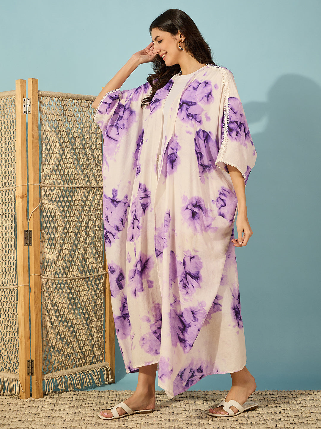 Stylish and airy purple tie-dye coverup with intricate lace accents, perfect for seaside strolls.
