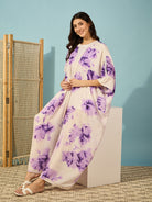 Effortlessly cool purple tie-dye coverup with open front and lace details, perfect for resort wear.

