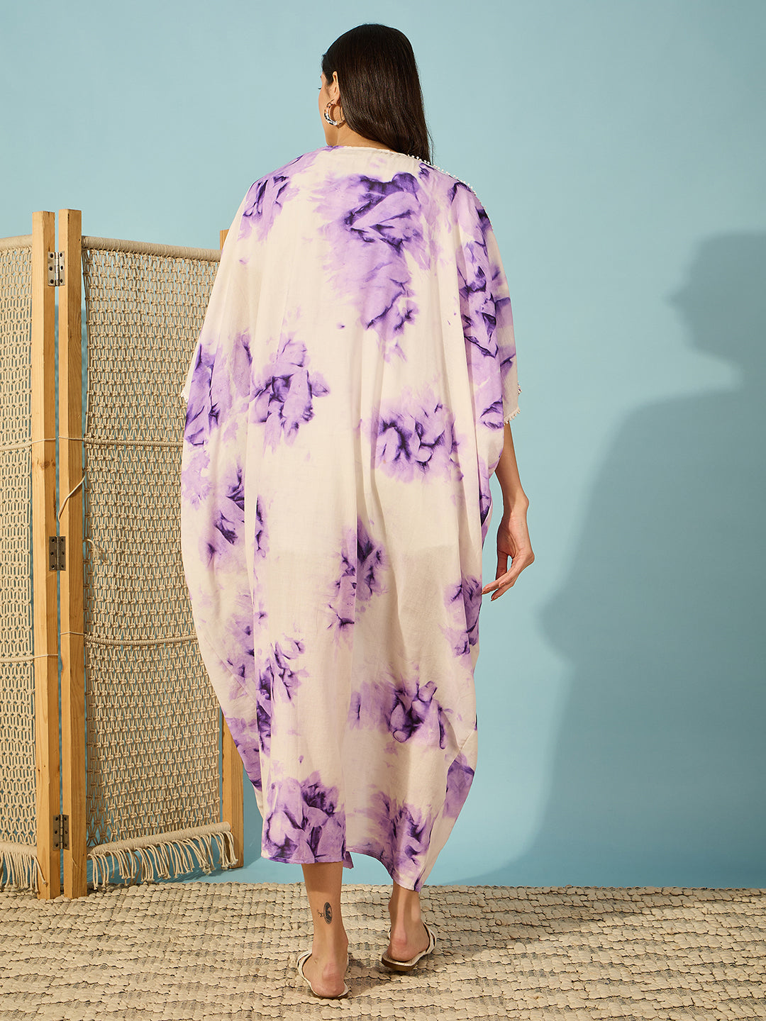 Charming purple tie-dye coverup with lace detailing, perfect for a laid-back resort look.
