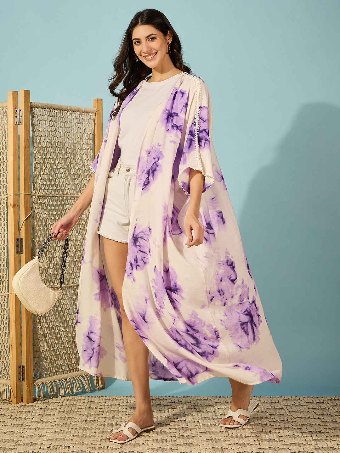 Chic purple tie-dye resort coverup for women with three-quarter sleeves, ideal for layering over swimwear.
