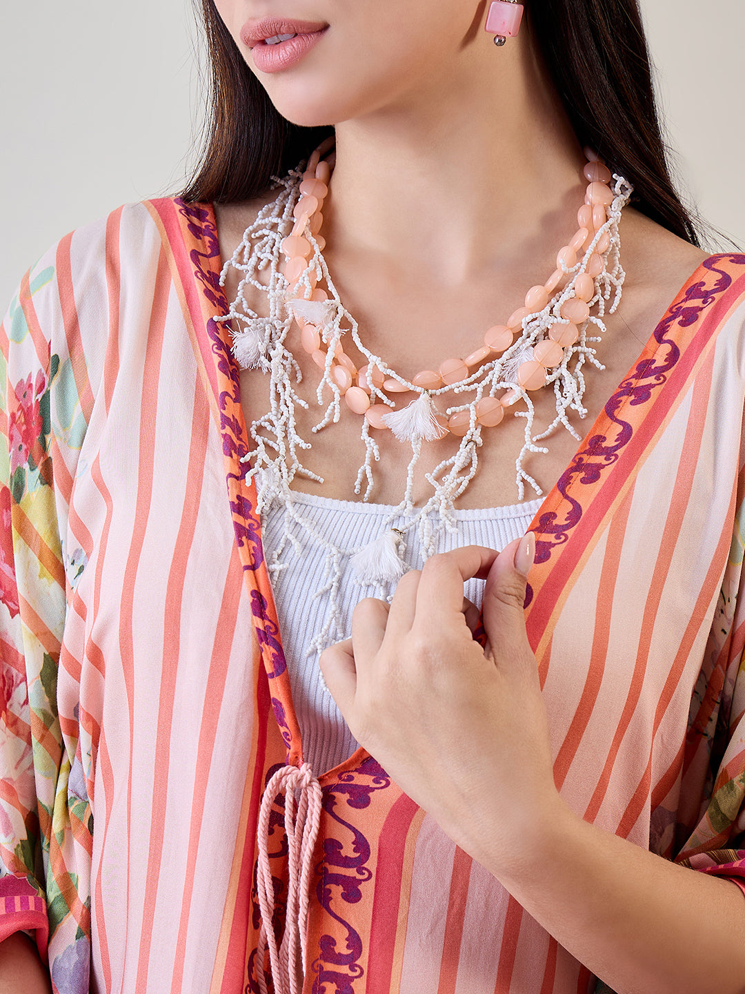 Stay cool and fashionable by the pool in the Orange Abstract Striped Viscose Kaftan Resort Cover-Up
