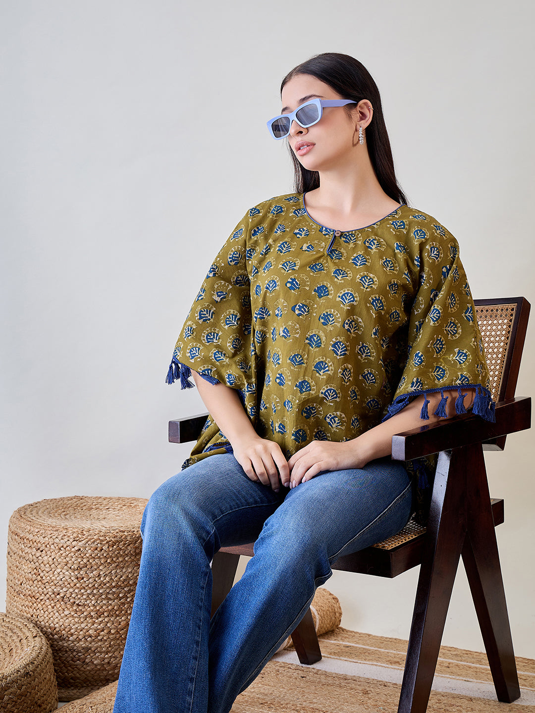 Embrace vibrant colors with the Bright Blue Tasseled Green Cotton Ethnic Motifs Kaftan Top.
