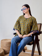 Embrace vibrant colors with the Bright Blue Tasseled Green Cotton Ethnic Motifs Kaftan Top.
