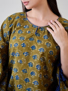 Upgrade your wardrobe with the Bright Blue Tasseled Green Cotton Kaftan featuring ethnic motifs.
