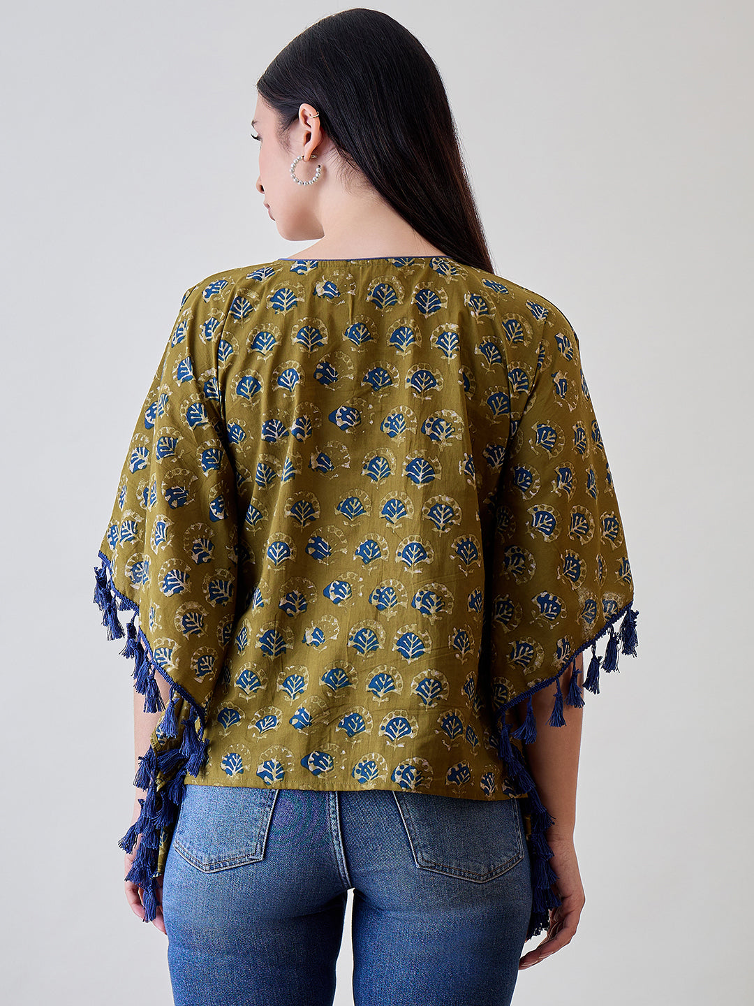Experience the beauty of ethnic design with the Bright Blue Tasseled Green Cotton Kaftan Top.
