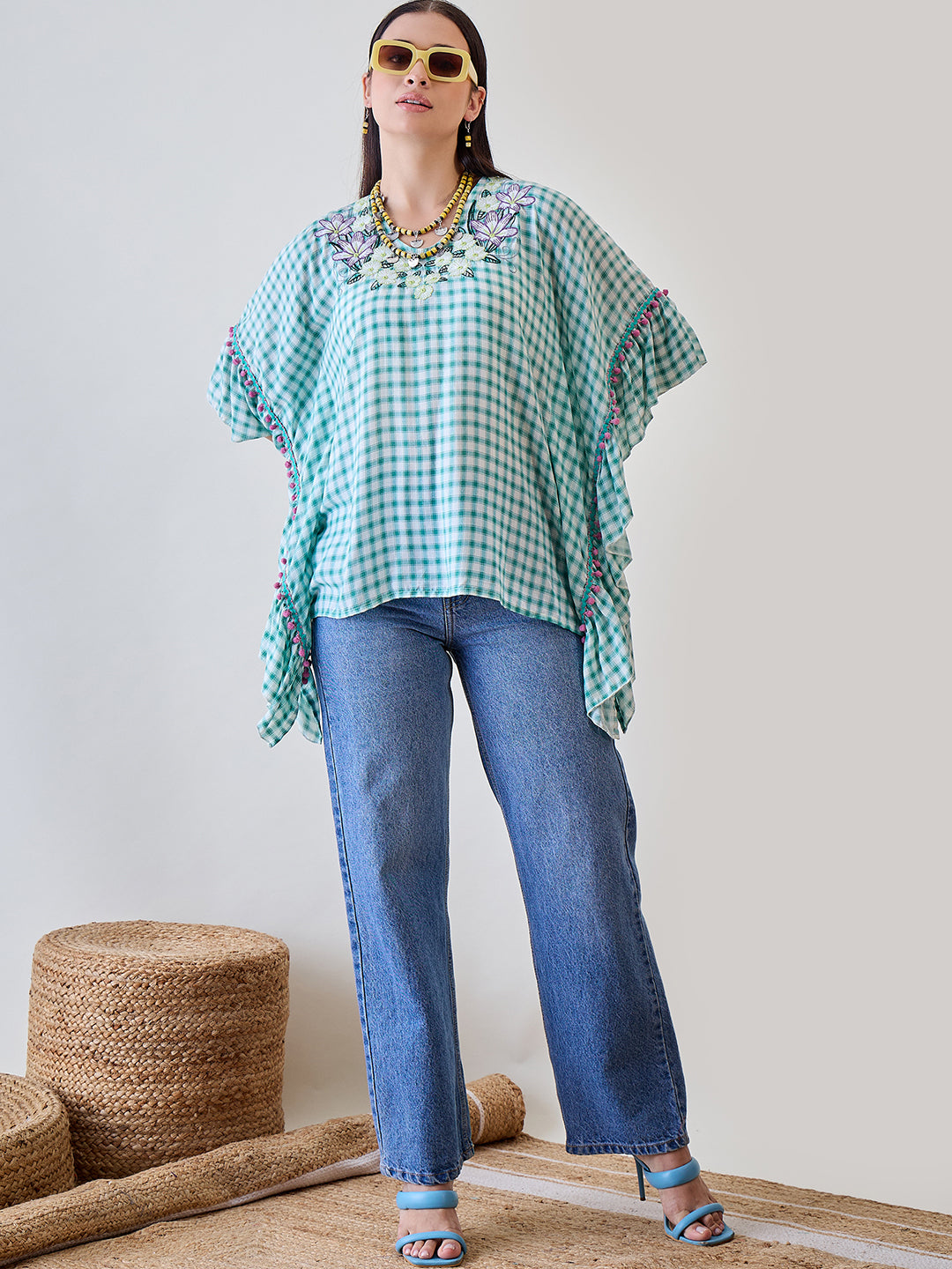 Stay fashionable and cozy in the Green Gingham Floral Embroidered Cotton Kaftan Top.

