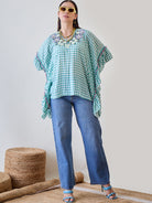 Stay fashionable and cozy in the Green Gingham Floral Embroidered Cotton Kaftan Top.
