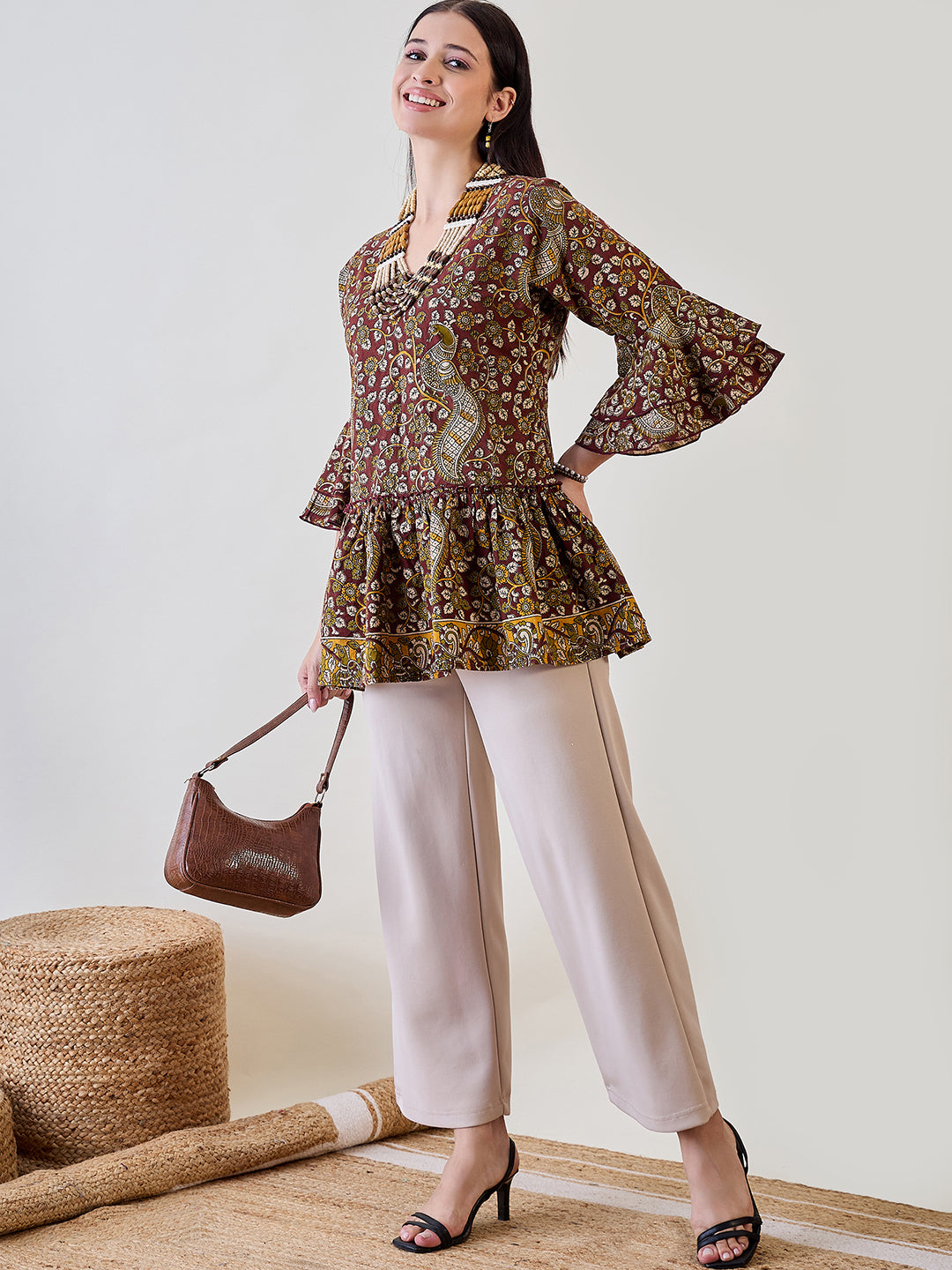 Upgrade your casual wear with the Kalamkari Ethnic Printed Cotton Peplum Top for effortless elegance
