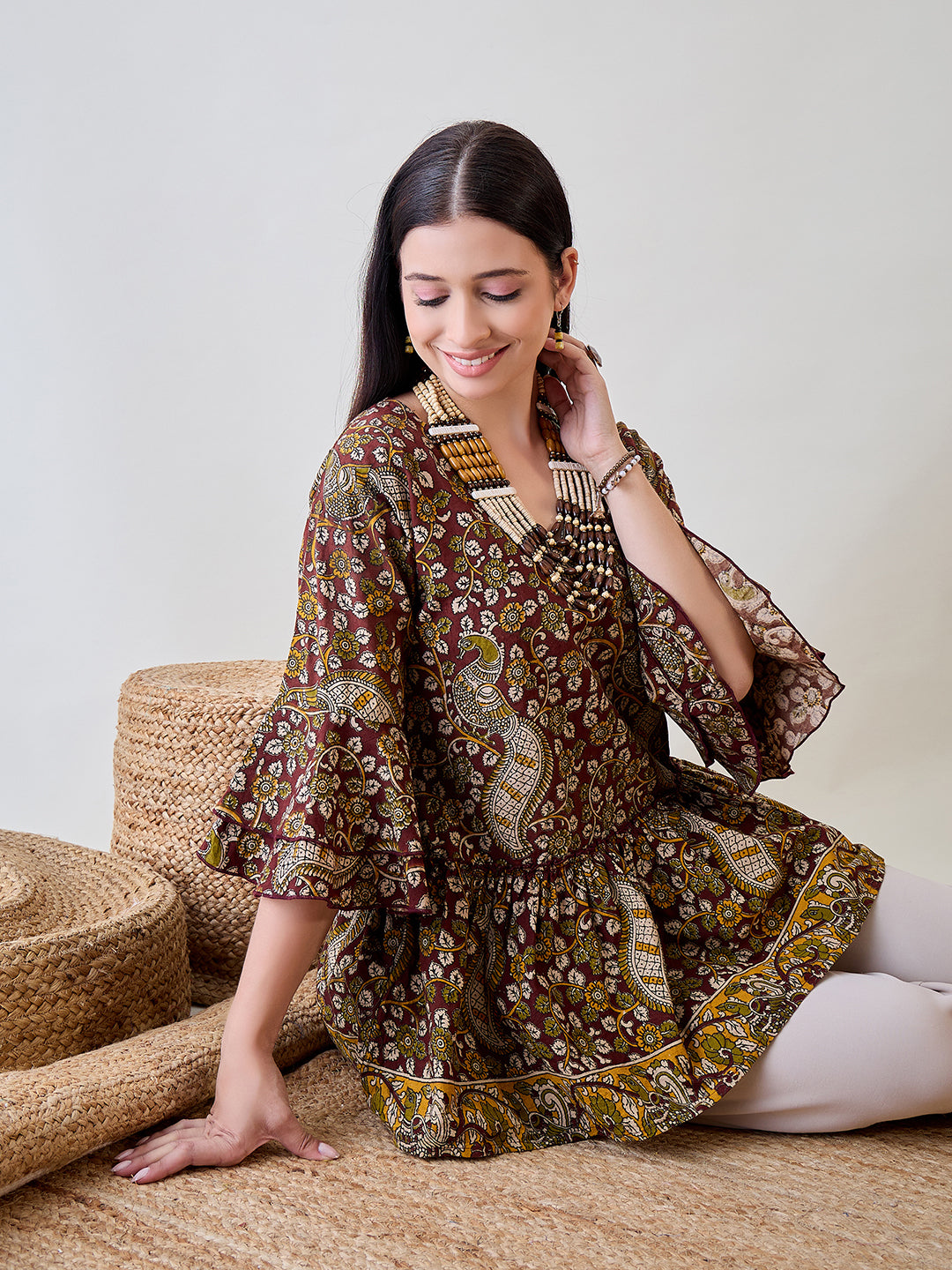 Feel the comfort and style of the Kalamkari Ethnic Printed Cotton Peplum Top, perfect for any occasion
