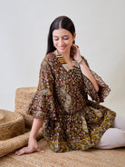 Feel the comfort and style of the Kalamkari Ethnic Printed Cotton Peplum Top, perfect for any occasion
