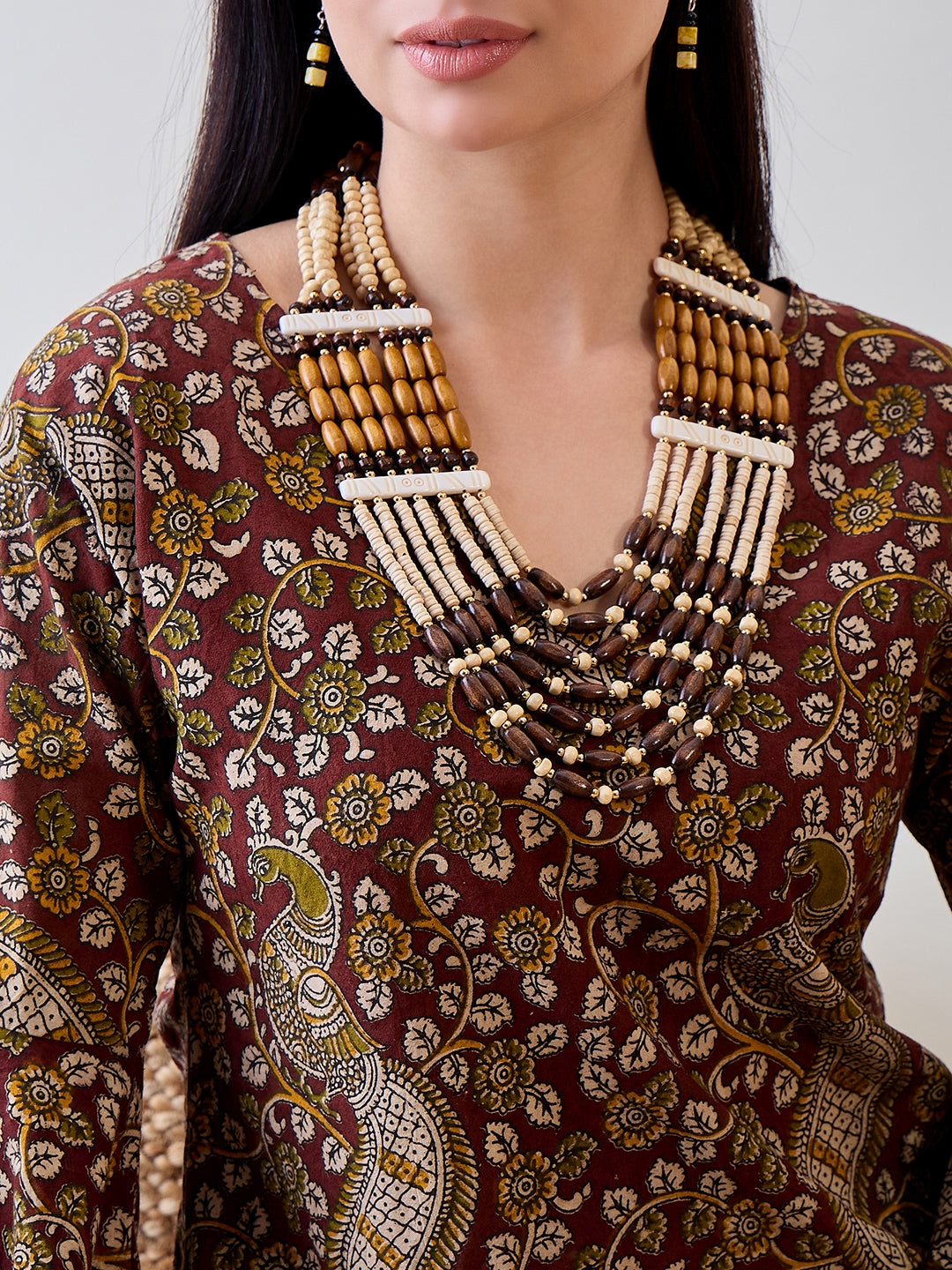Embrace traditional prints with the Kalamkari Ethnic Printed Cotton Peplum Top for a unique, fashionable look
