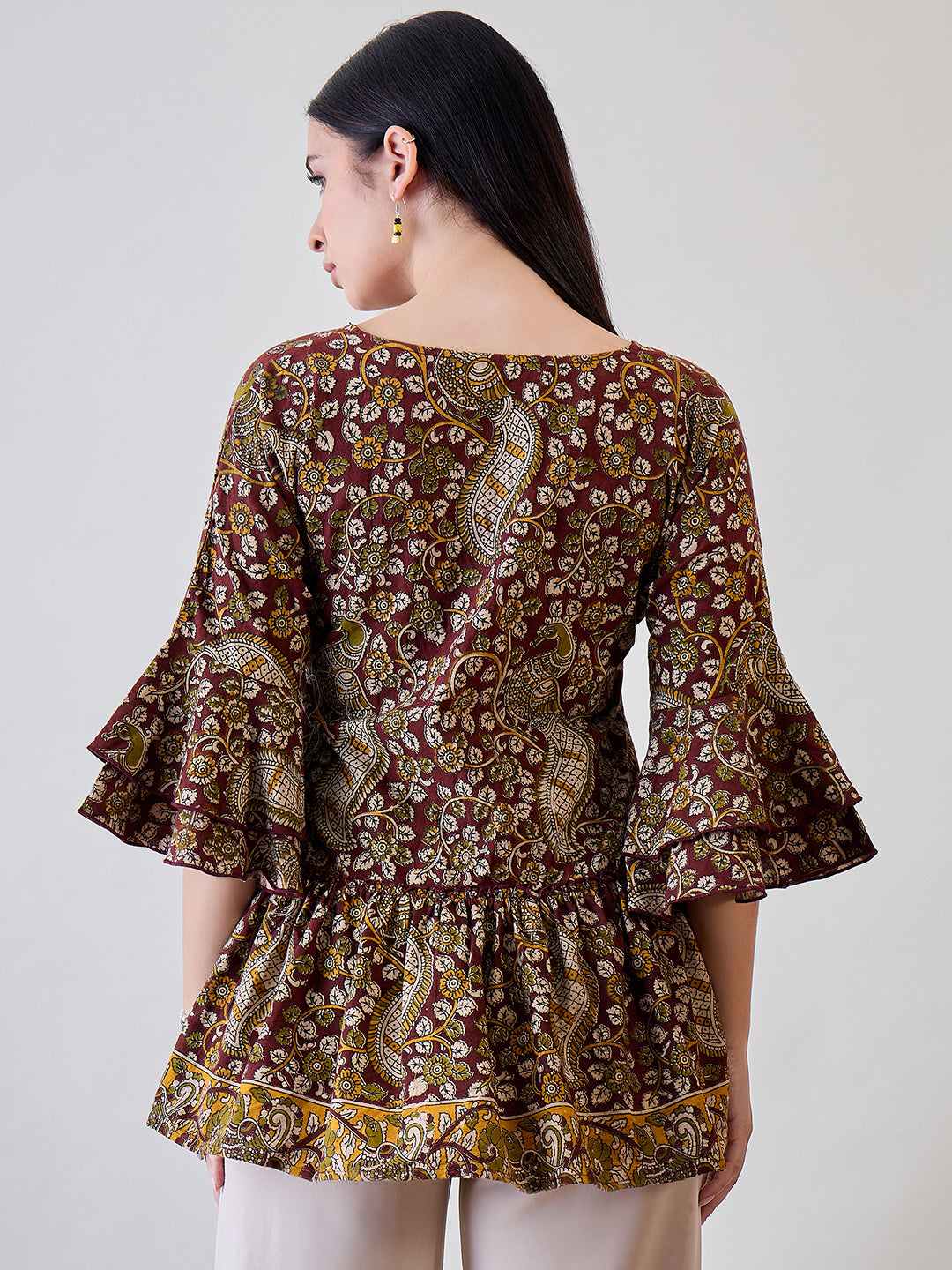 Make a statement with the Kalamkari Ethnic Printed Cotton Peplum Top, designed for modern elegance
