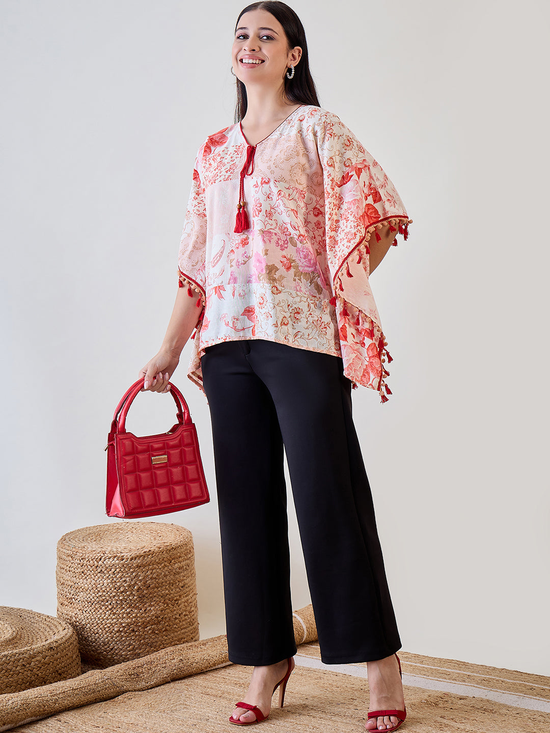 Cotton kaftan top in beige with red pom-pom lace embellishments, perfect for adding a playful touch to your wardrobe.
