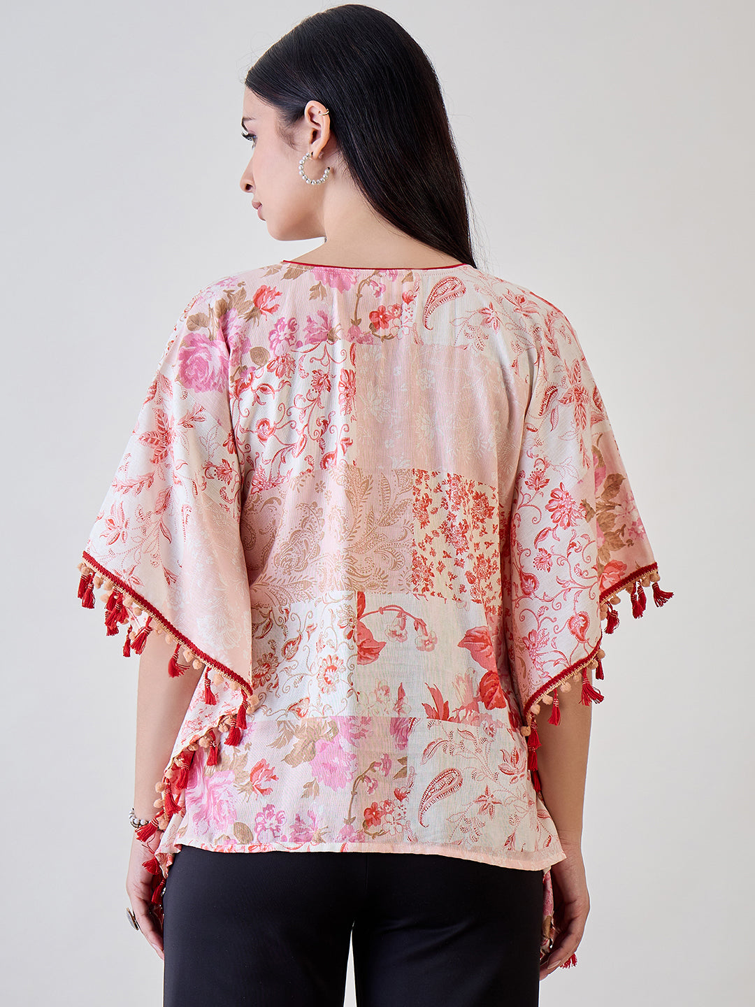 Cotton kaftan top with beige and red pom-pom lace accents, offering a feminine and playful addition to your casual wardrobe.
