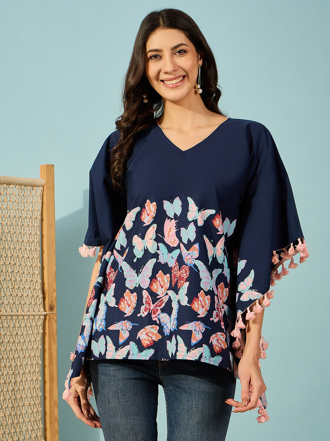 Women vibrant blue butterfly print cotton kaftan top with pink tassels - Perfect for daytime wear.
