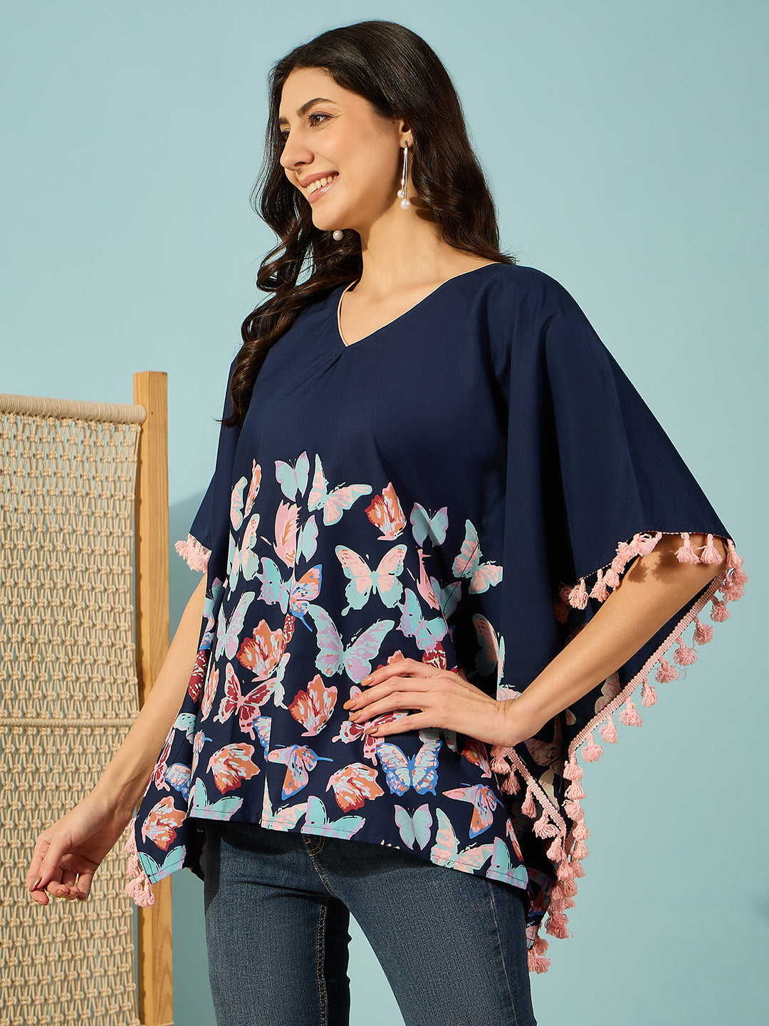Relaxed-fit cotton kaftan top with butterfly motifs and playful tassels on sides - Stylish summer top.
