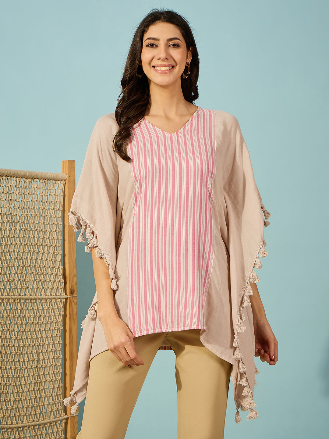 Stylish beige and pink striped cotton kaftan top for women, V-neck with side tassels.
