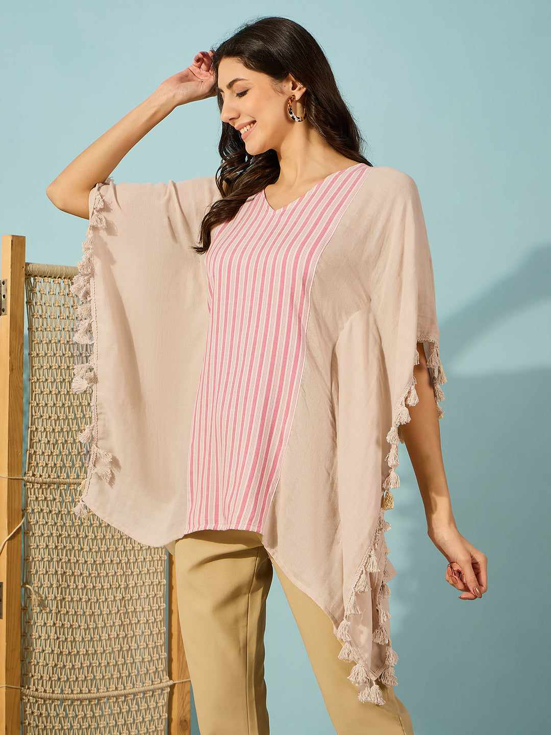 Elegant cotton kaftan in soft beige and pink stripes, perfect for casual daywear.

