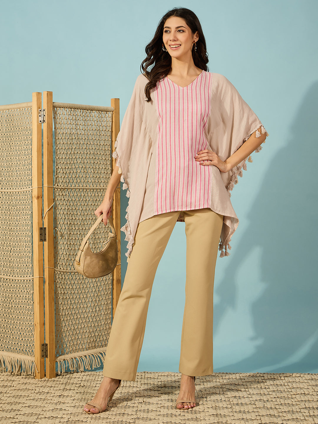 Comfy and stylish cotton kaftan top with pink and beige stripes, ideal for casual outings.
