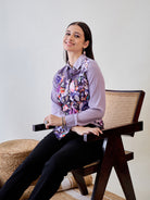 Trendy women's button-down shirt in purple crepe fabric with an eye-catching painted design.
