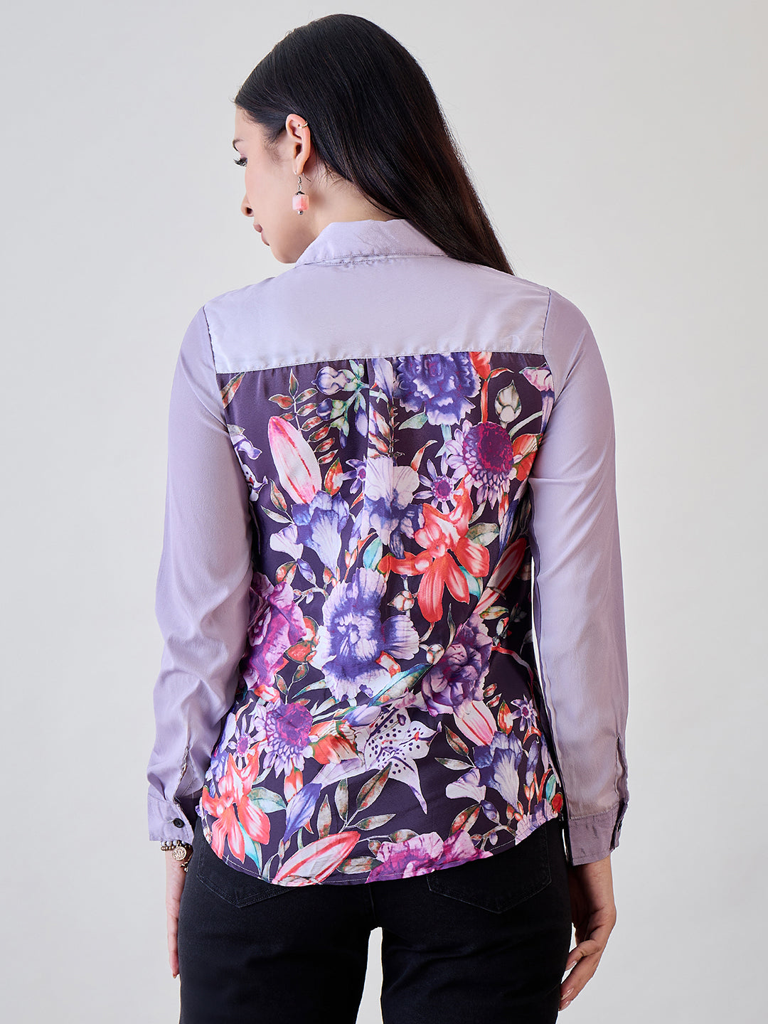 Stylish purple crepe button-down shirt with unique painted prints, perfect for pairing with jeans or skirts.
