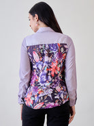 Stylish purple crepe button-down shirt with unique painted prints, perfect for pairing with jeans or skirts.
