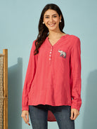 Casual red cotton shirt for women with playful elephant embroidery on the chest pocket.
