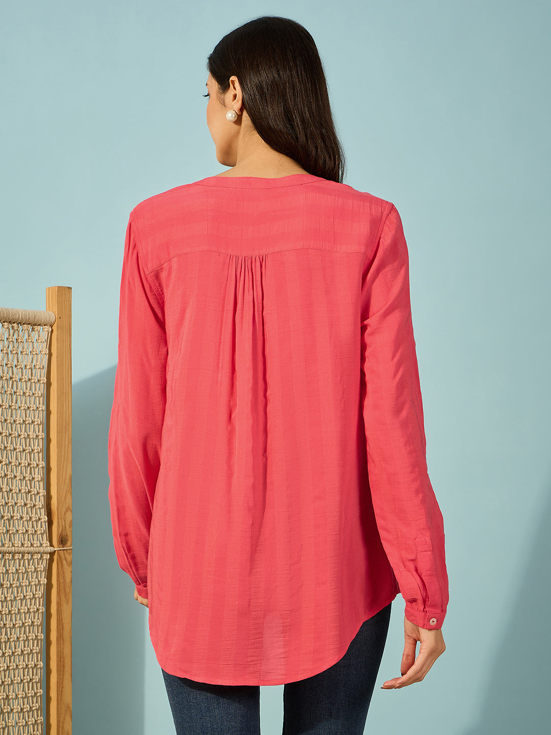 Stylish red cotton shirt with detailed elephant embroidery, ideal for casual wear.
