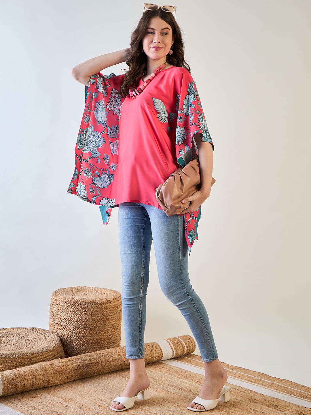 Stylish red kaftan with intricate floral designs for a chic look.