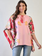 Pink and yellow floral kaftan top with butterfly designs.