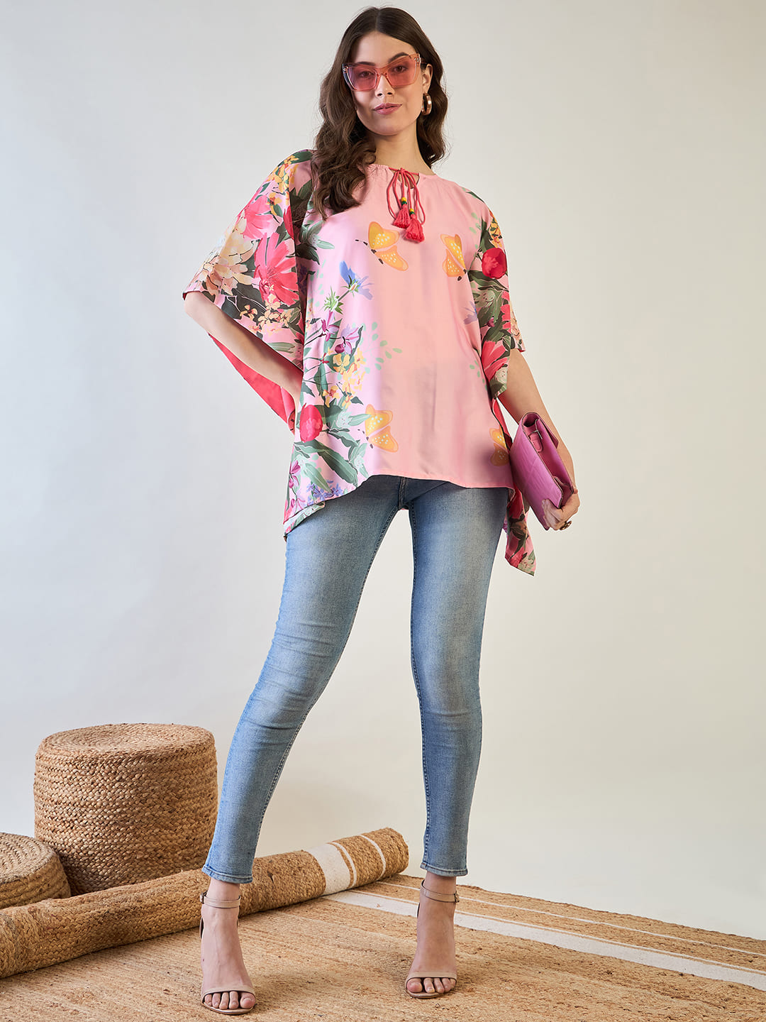 red tassel dori neckline on the kaftan top.