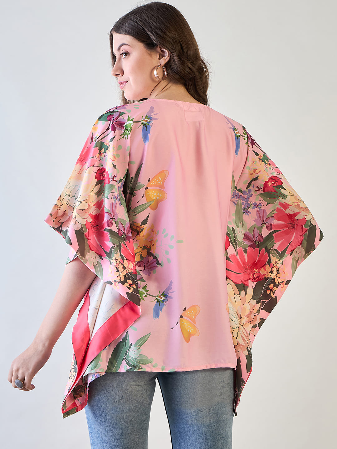 Pink and yellow floral kaftan top styled with beads and tassels.