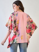 Pink and yellow floral kaftan top styled with beads and tassels.