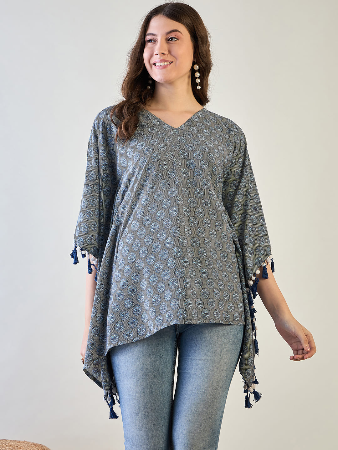 The luxurious poly crepe fabric flowing elegantly on the kaftan top.